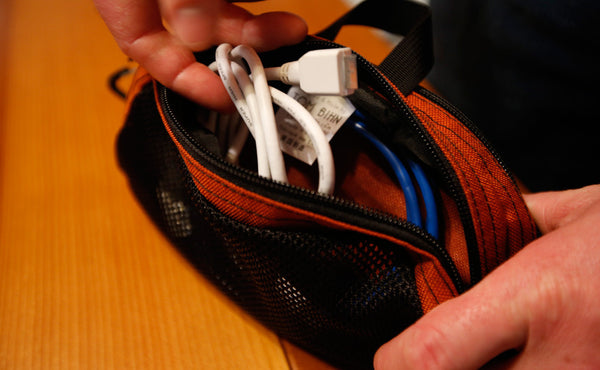 A person retrieving a cable from a Small Snake Charmer.